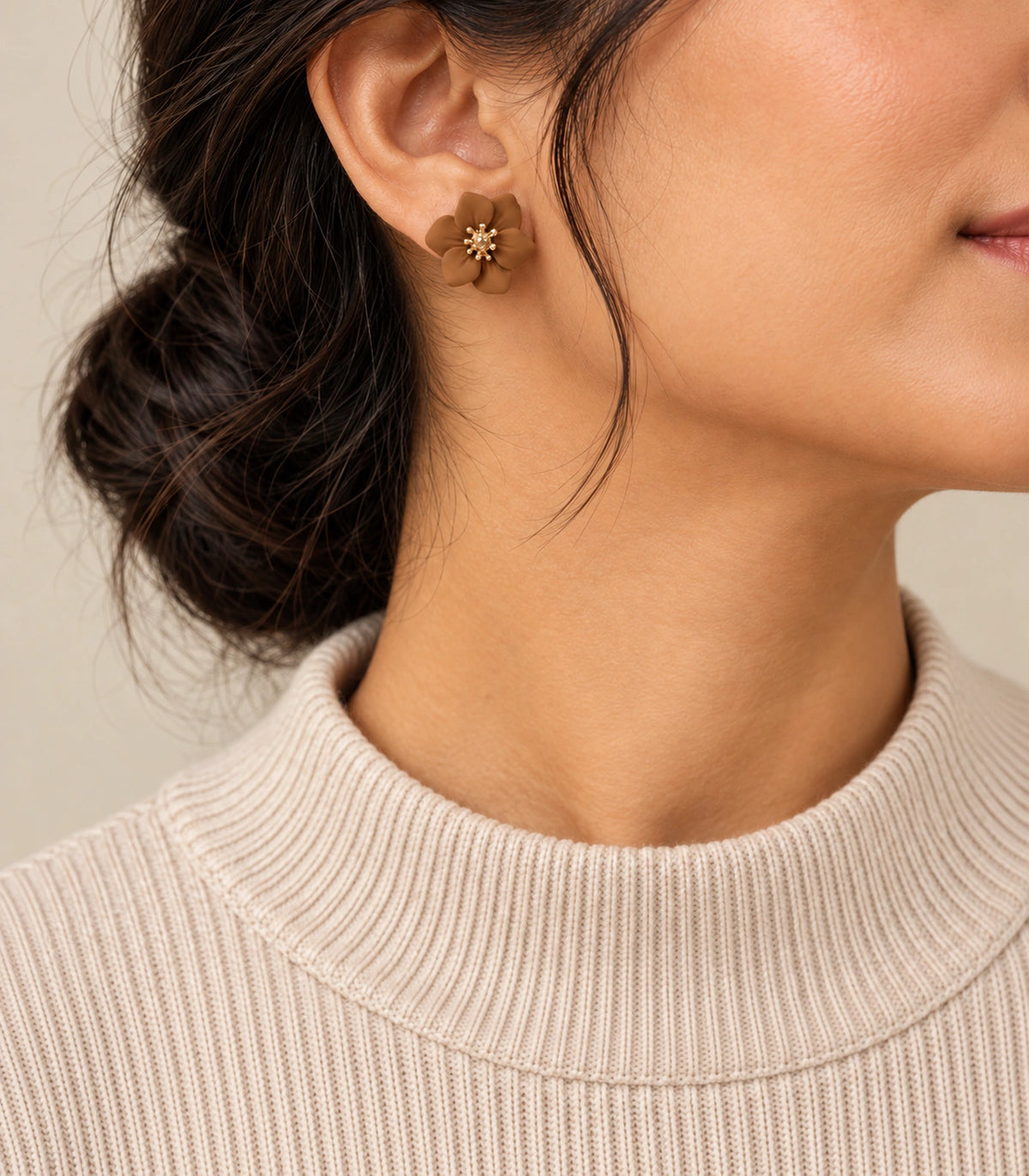 JIMIKI Camel compact six petal flower stud earrings, styled portrait showing the flower stud at the ear #color_camel