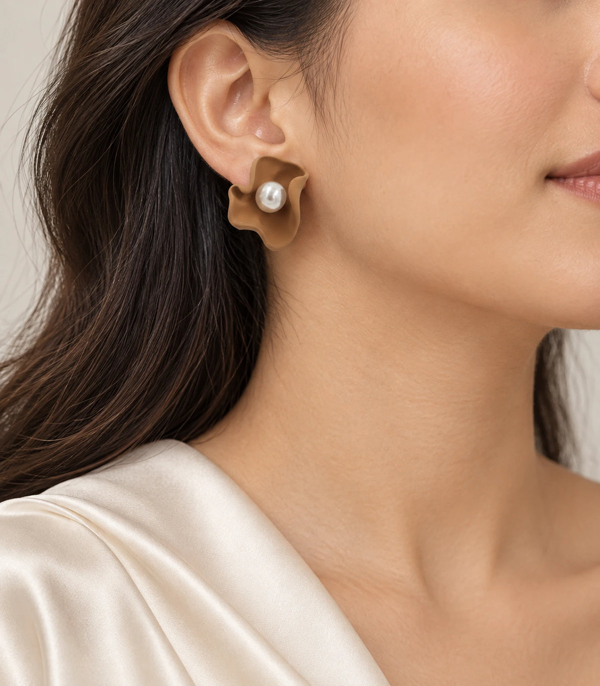 JIMIKI Folded Calla Pearl Stud Earrings, Camel — worn on the ear #color_camel