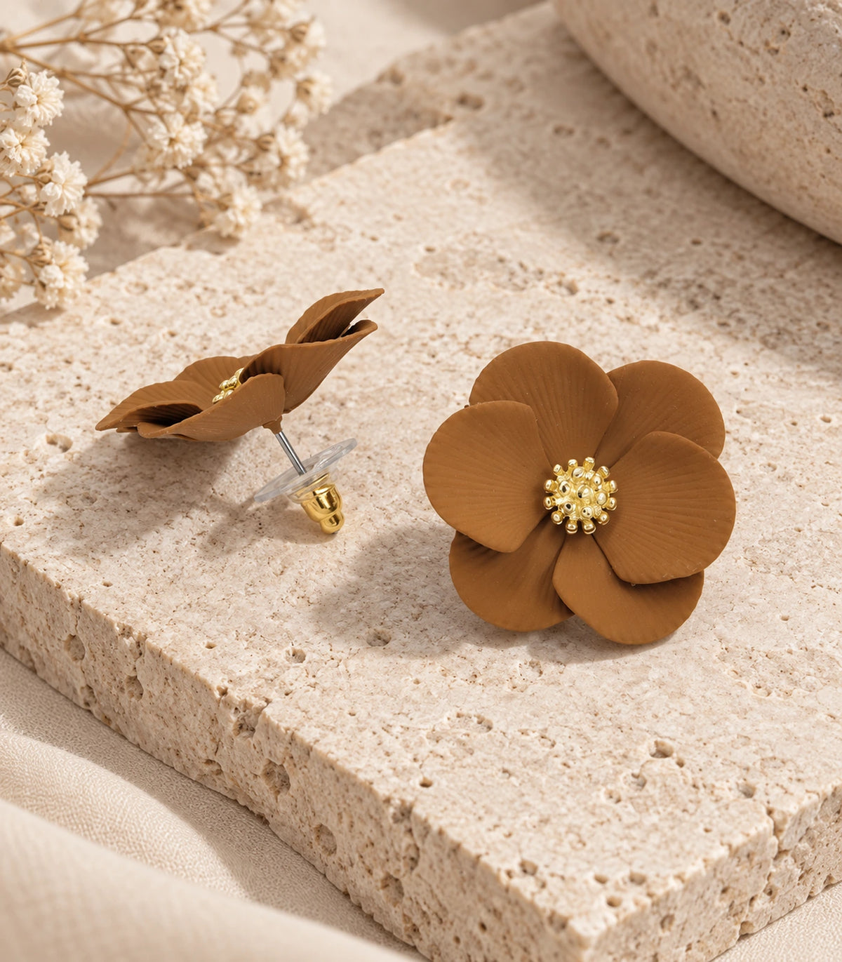 JIMIKI Camel ribbed flower stud earrings, pair arranged in an editorial flat lay #color_camel