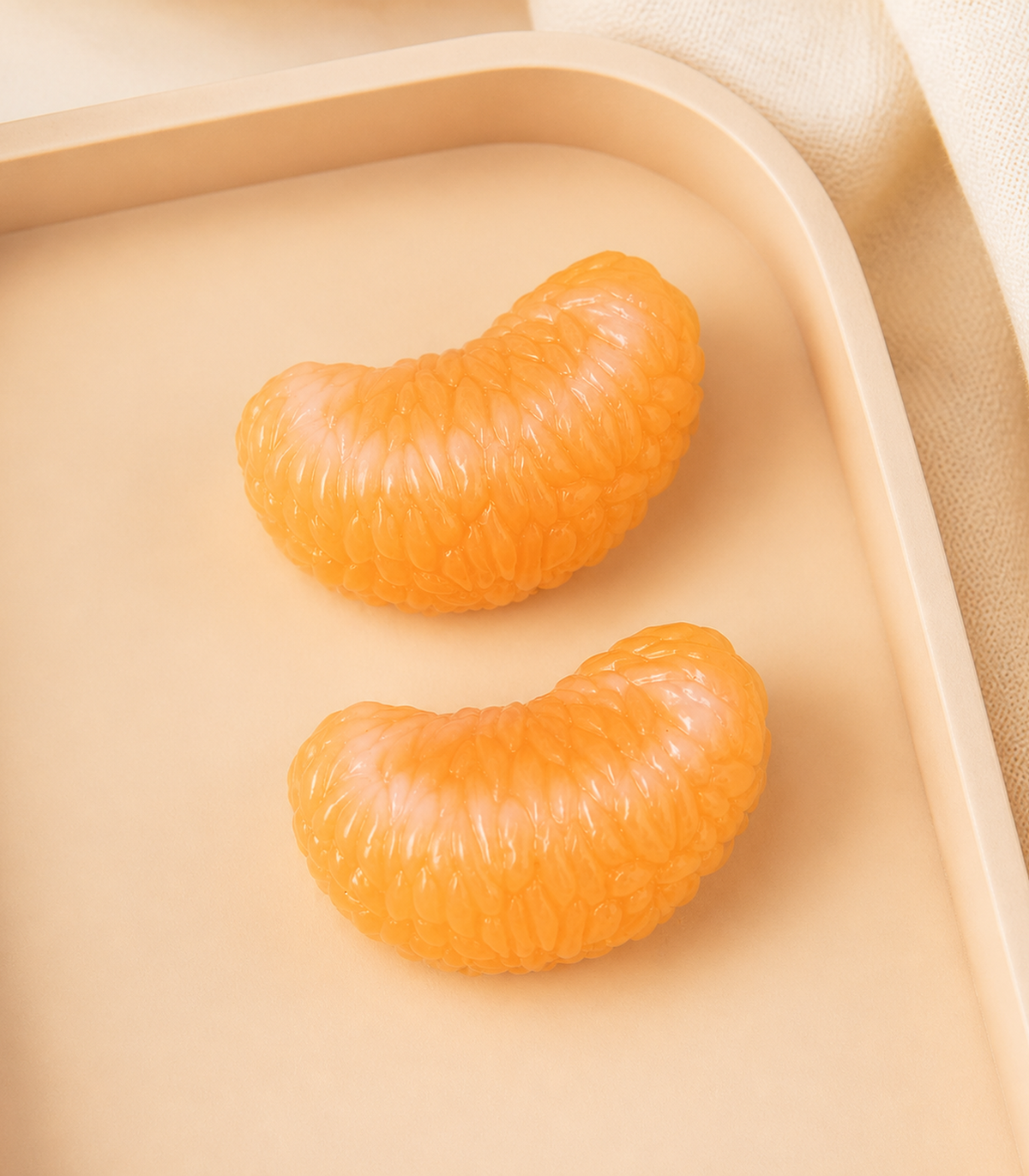 Citrus Segment Barrette Pair editorial flat lay
