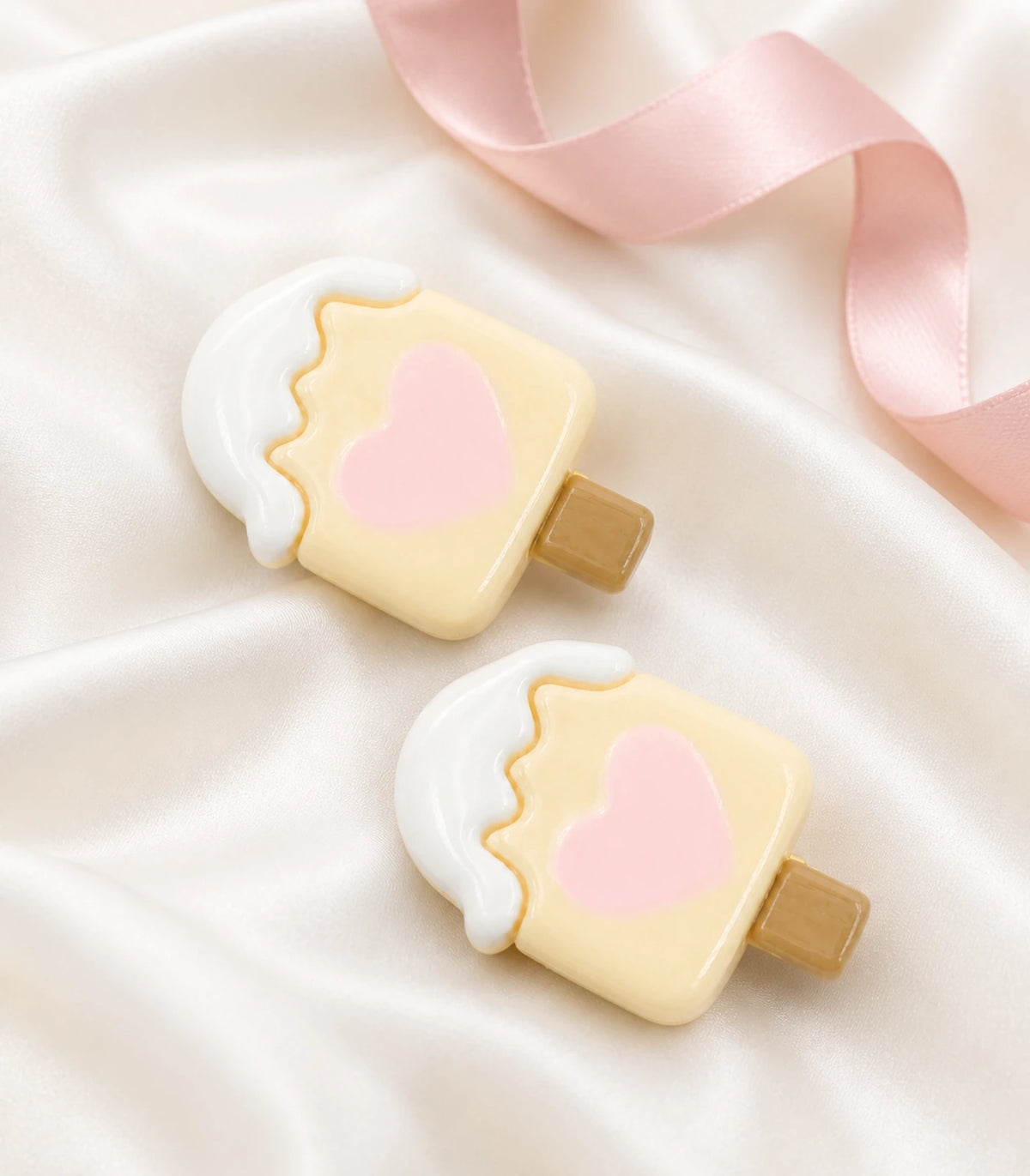 Editorial flat lay of the Cream Heart Popsicle Clip Pair