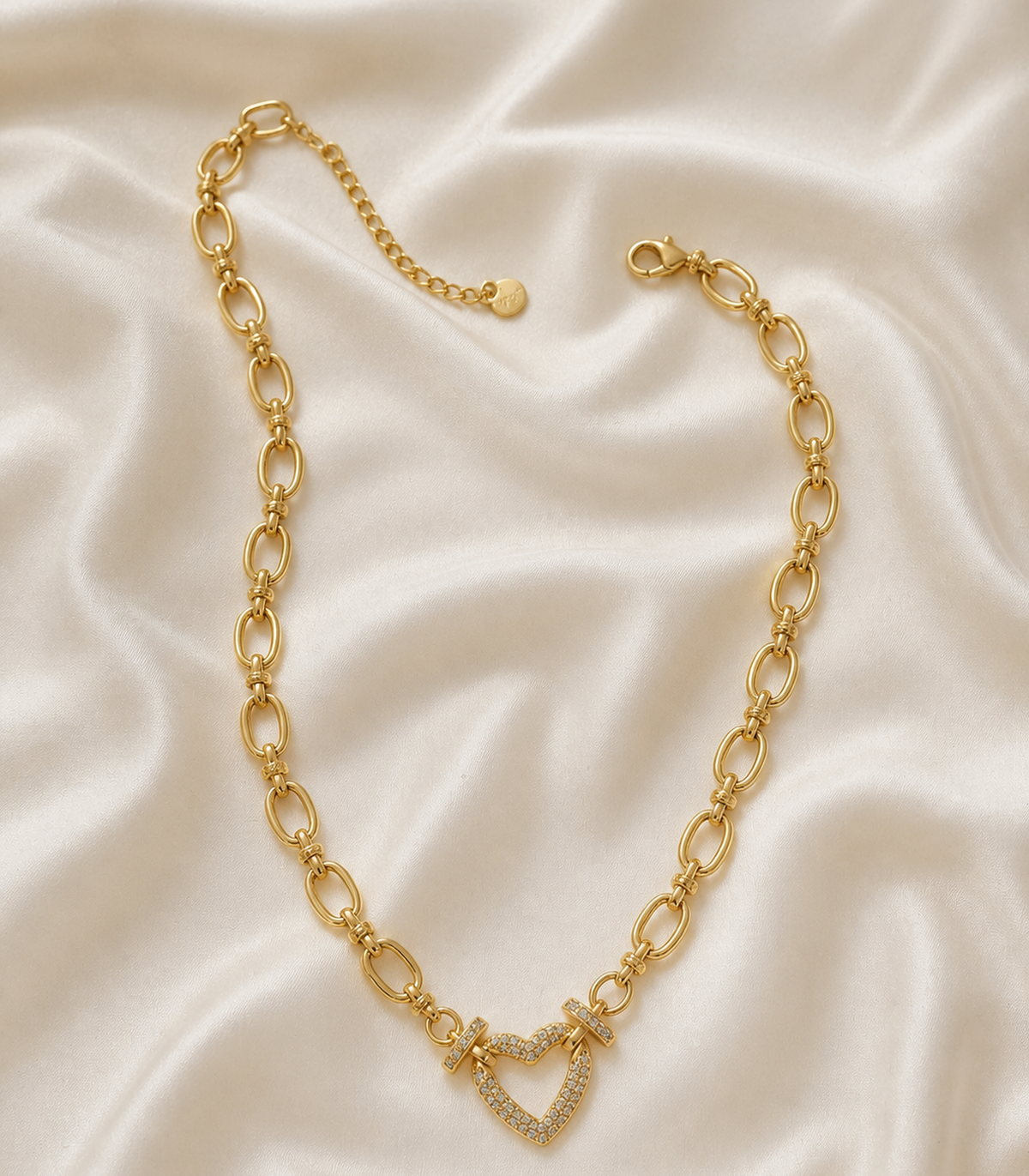 Crystal Heart Oval Link Necklace styled in a flat lay
