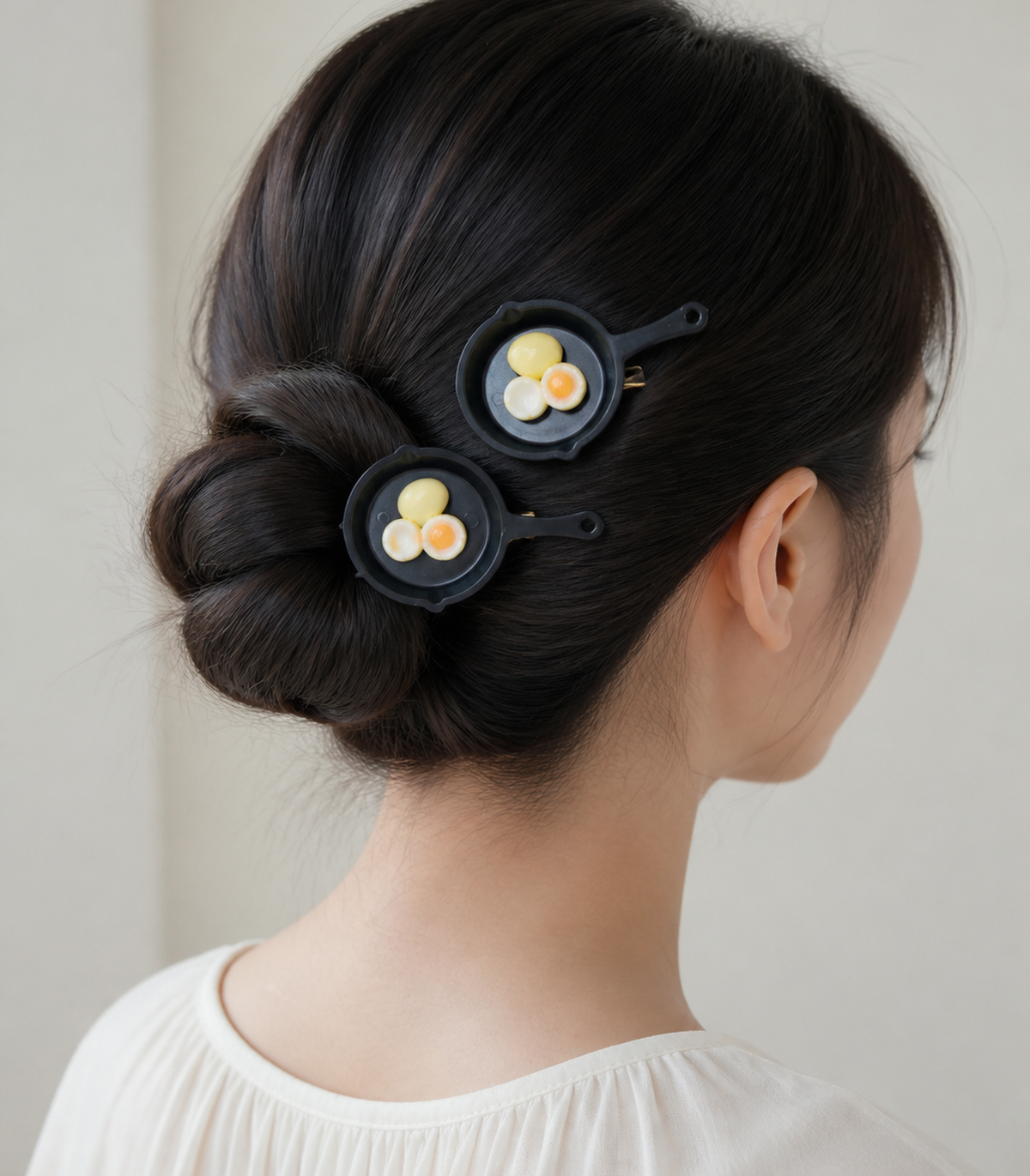 JIMIKI Egg Trio Frying Pan Barrette Pair in Black / Cream / Orange, editorial hairstyle view