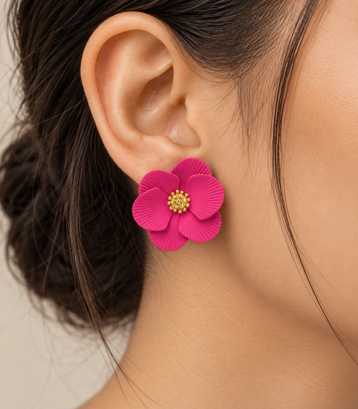 JIMIKI Fuchsia ribbed flower stud earrings, worn closeup of ribbed petals and gold-tone centre #color_fuchsia