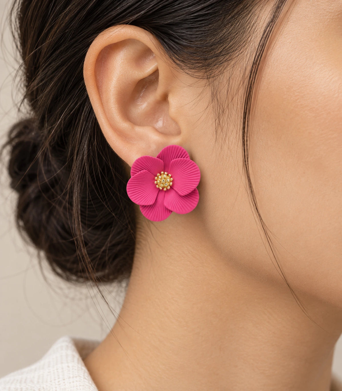 JIMIKI Fuchsia ribbed flower stud earrings, worn view showing the flower stud #color_fuchsia