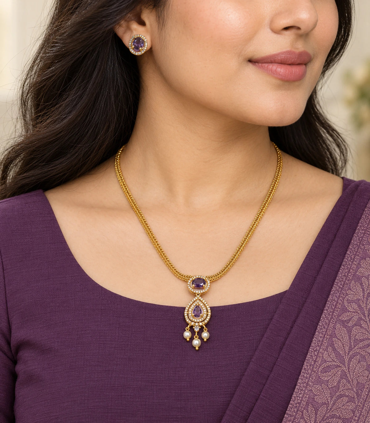 Amethyst-purple necklace set worn with gold-tone chain, teardrop pendant, three pearl-like drops and a matching oval stud