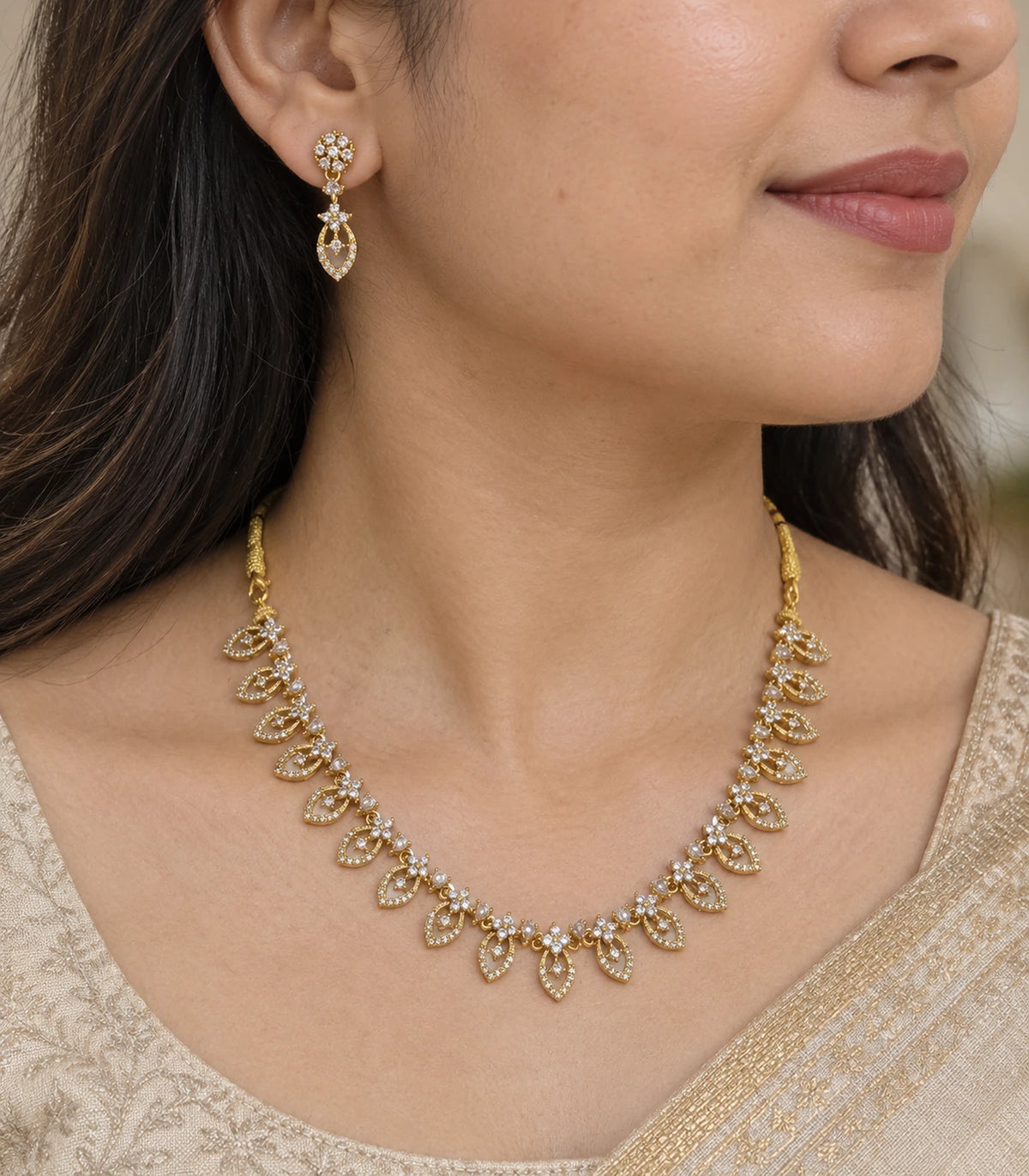 Close view of the clear marquise necklace and matching floral-top drop earring worn naturally