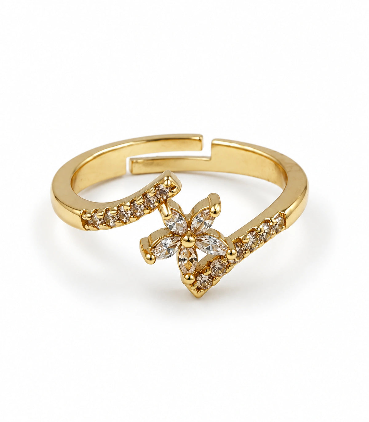One gold-tone sweep ring with clear central accents on white background