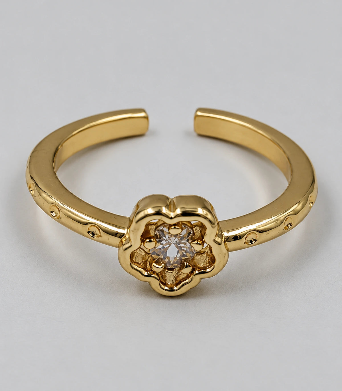 Close view of Gold Crystal Flower Open Ring and central clear accent