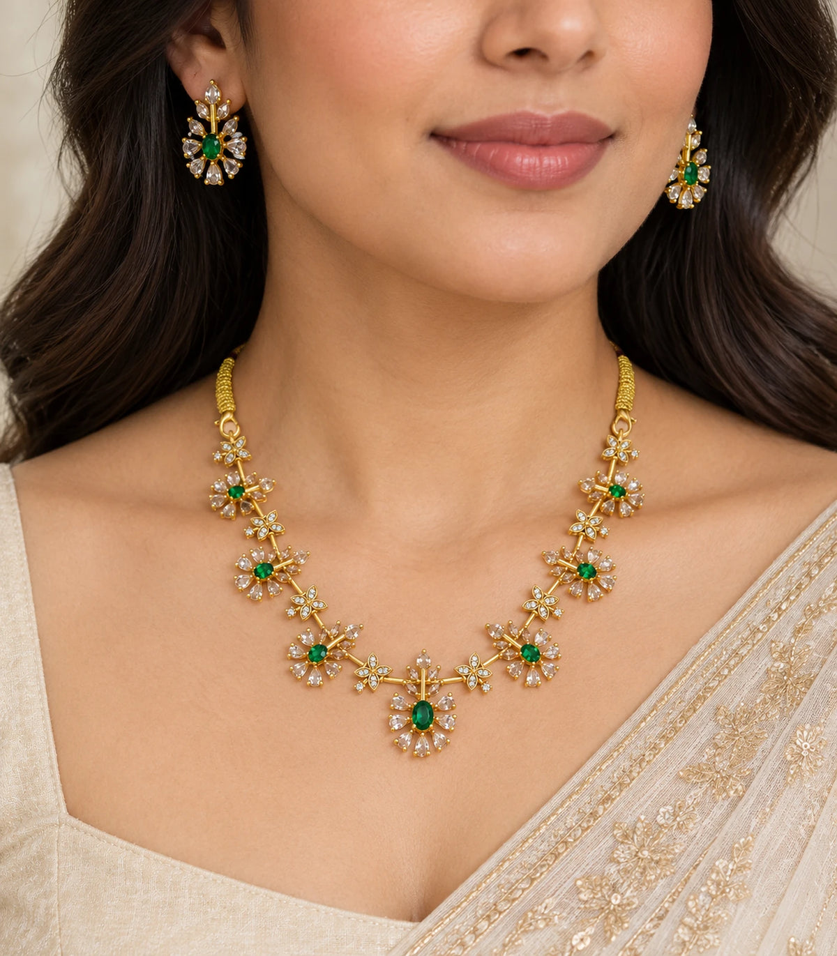 Gold Emerald Floral Crystal Necklace Set worn with cream saree and matching earrings
