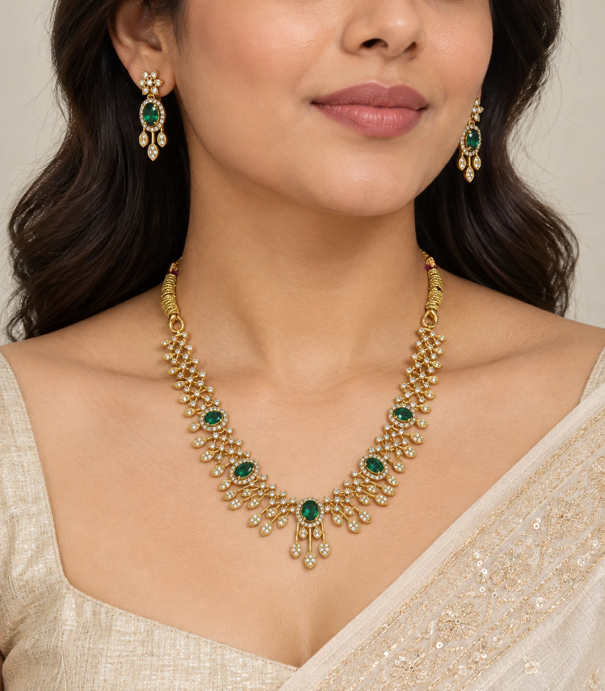JIMIKI emerald-green floral fringe necklace set worn with matching earrings