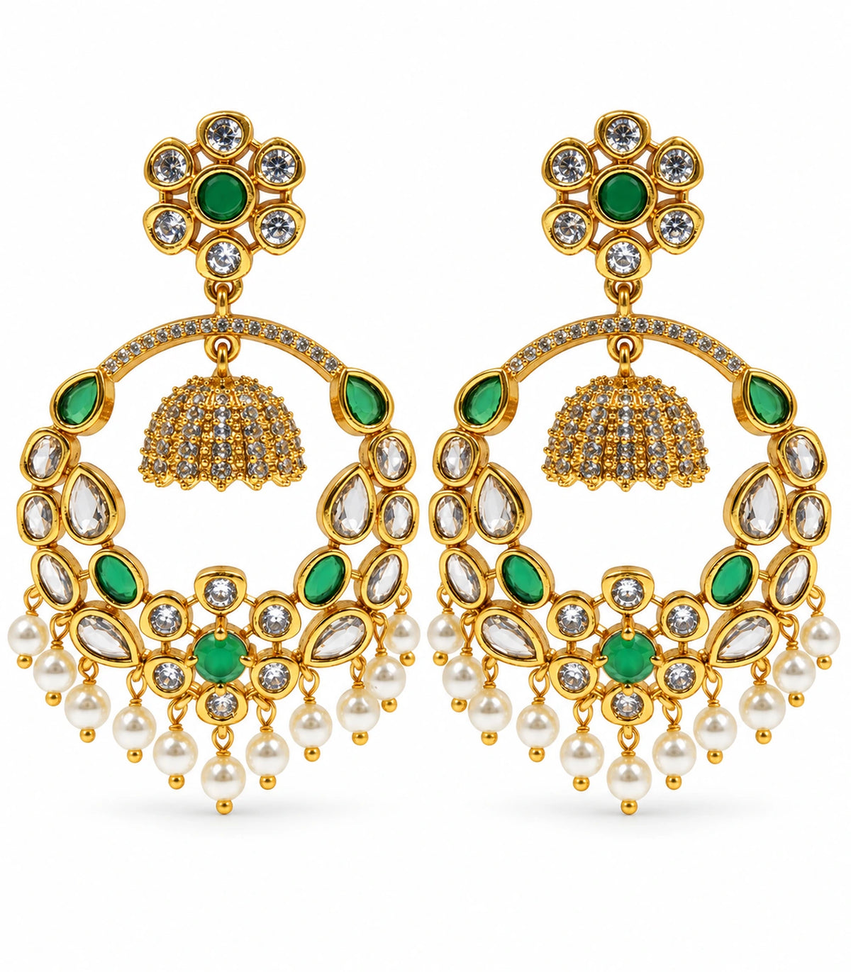 Matching pair of gold-tone green and clear chandbali earrings with floral studs, suspended mini bells and white pearl-like fringe on white