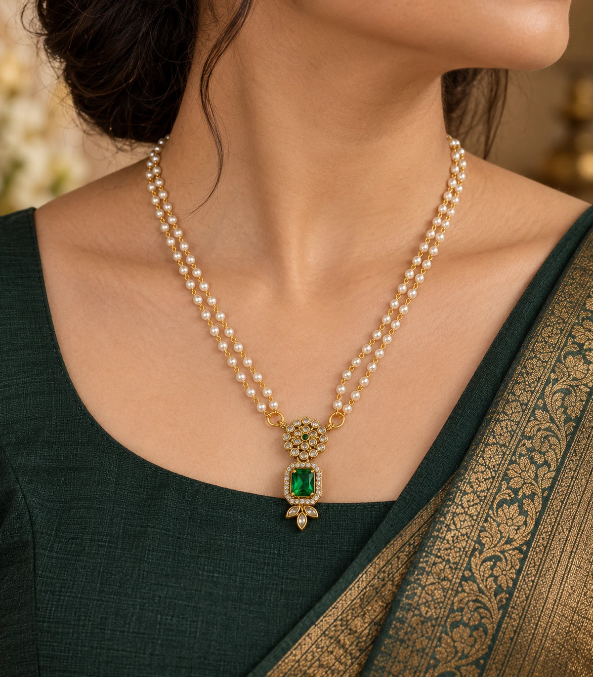Gold Emerald Kundan Double Pearl Necklace worn with a dark green outfit in a three-quarter view