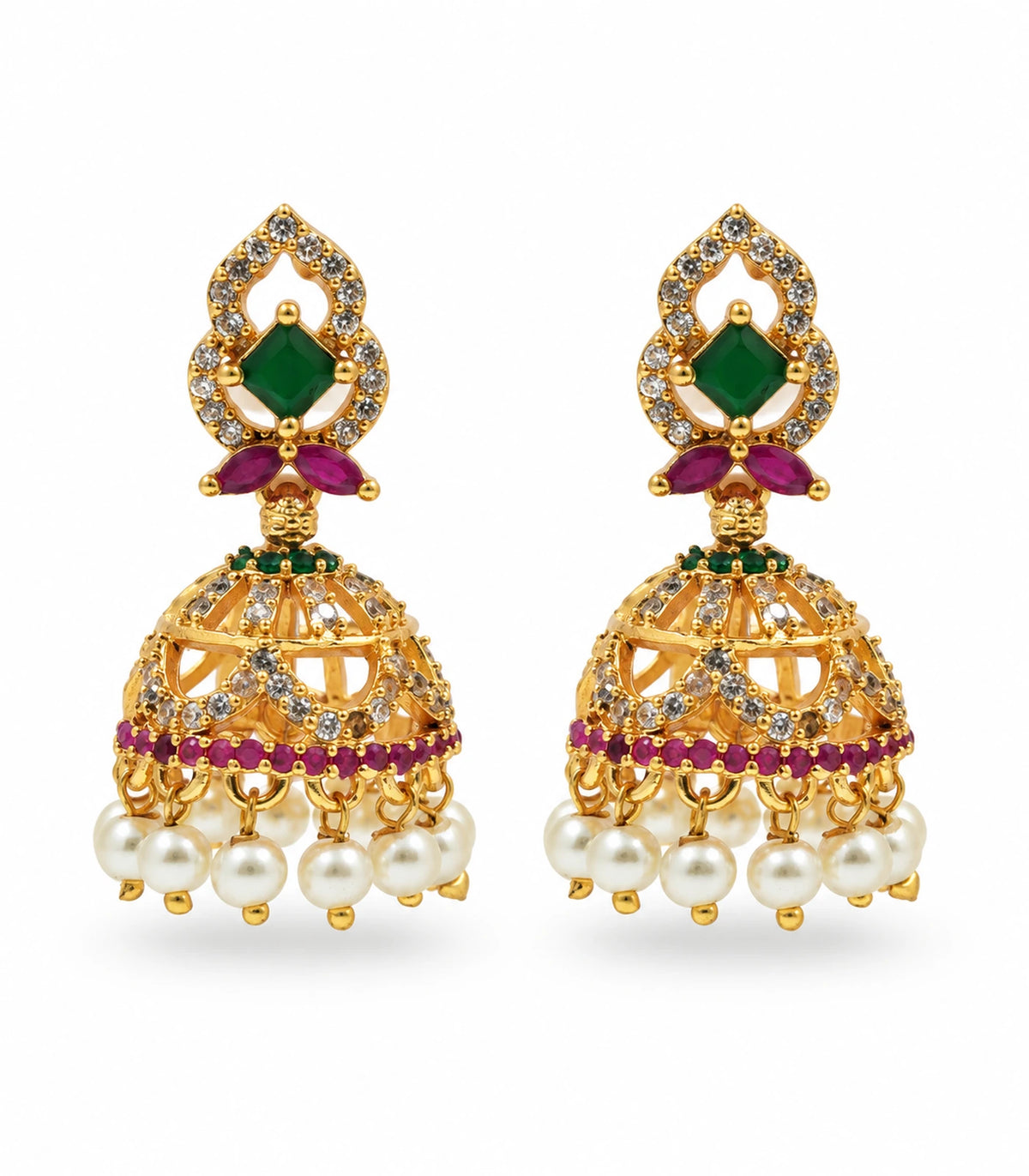 Pair of gold-tone green and magenta jhumka earrings with clear-stone openwork domes and white pearl-style fringe on white background