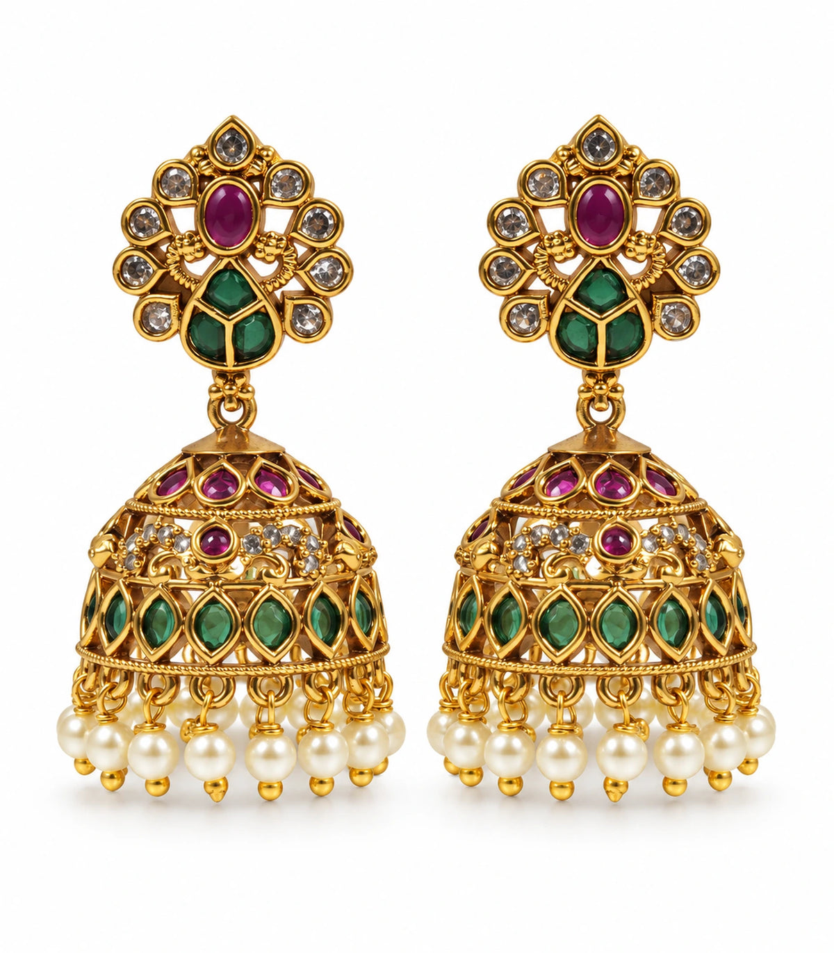 Matching pair of gold-tone peacock jhumka earrings with magenta and green accents and pearl-like fringe on white