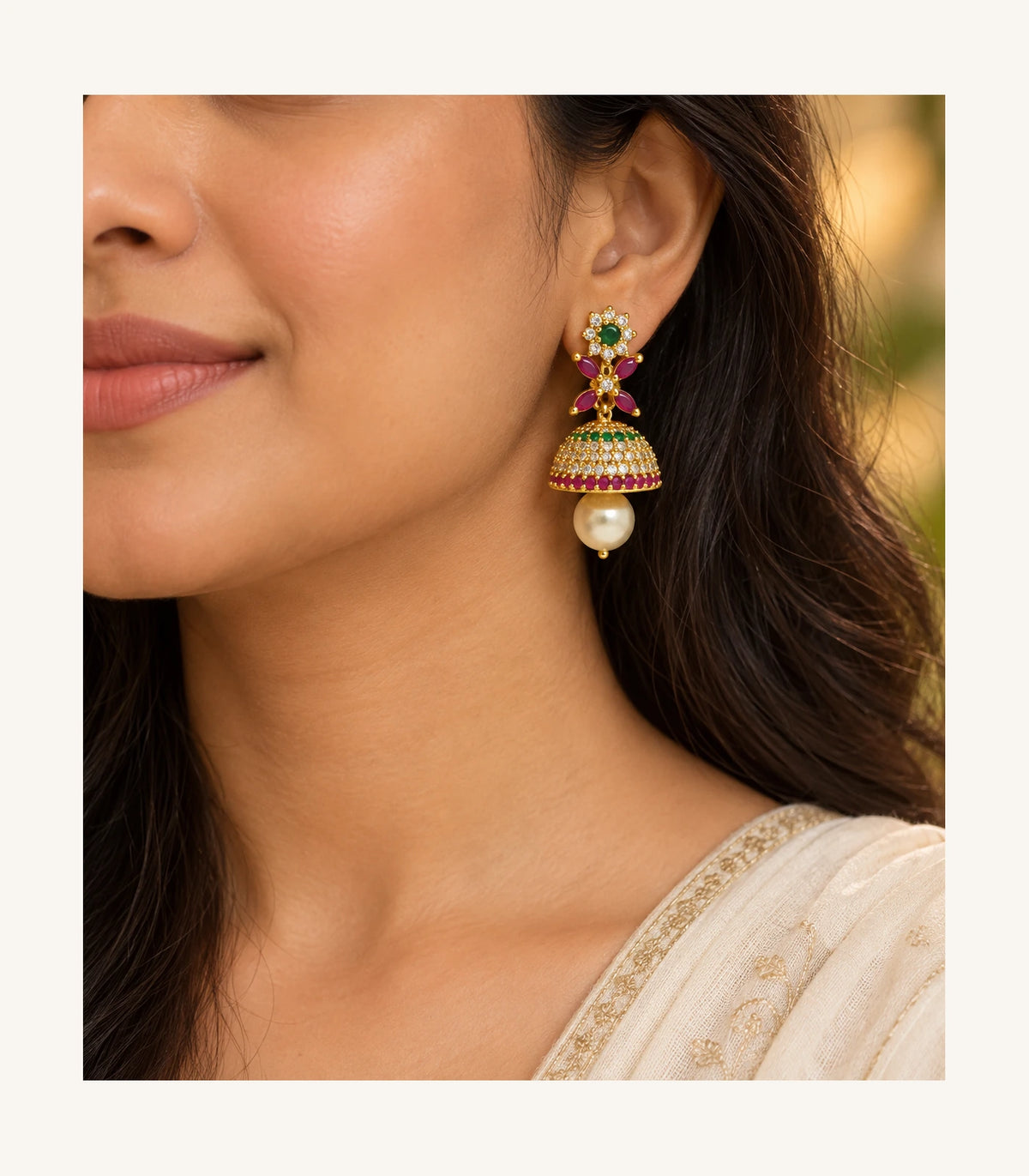 Gold multicolor floral earring in an editorial worn view