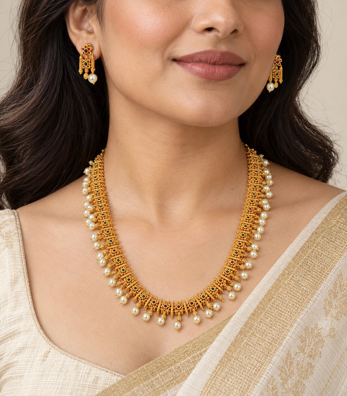 Gold multicolor pearl fringe necklace set worn with matching earrings