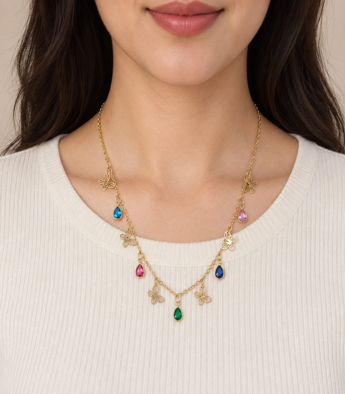 JIMIKI Gold Multicolor Teardrop Butterfly Charm Necklace - necklace worn with a cream top #color_gold