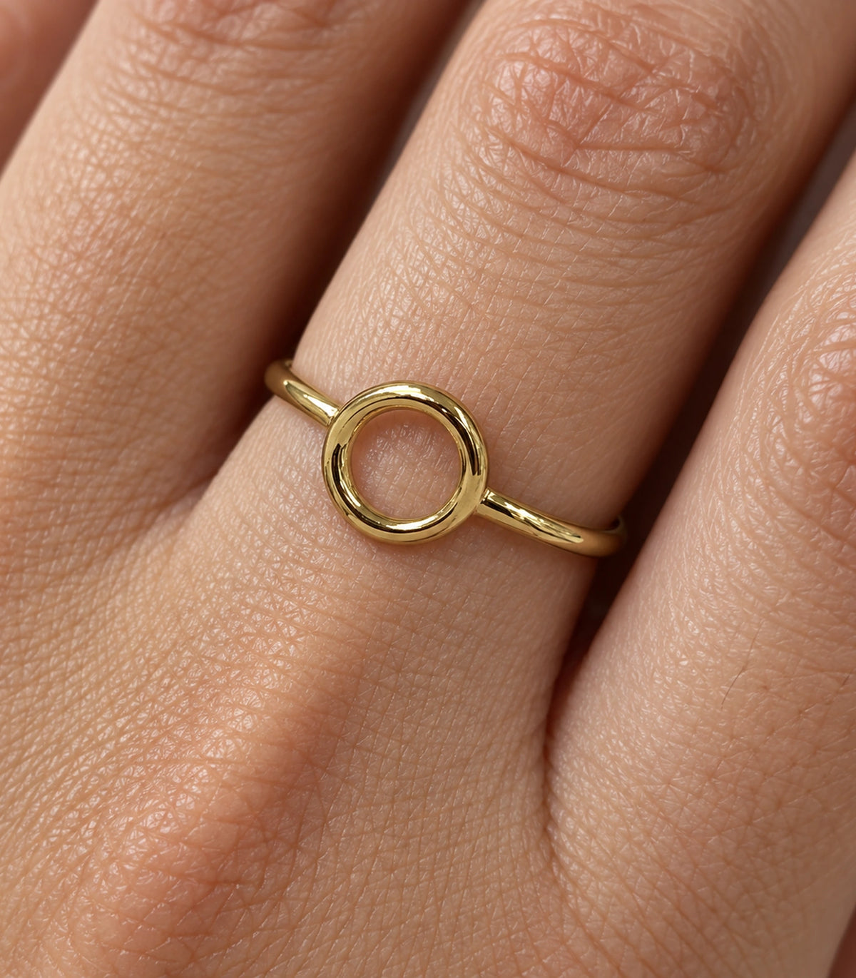 Closeup of Gold Open Circle Minimal Ring showing its plain hollow circular centre
