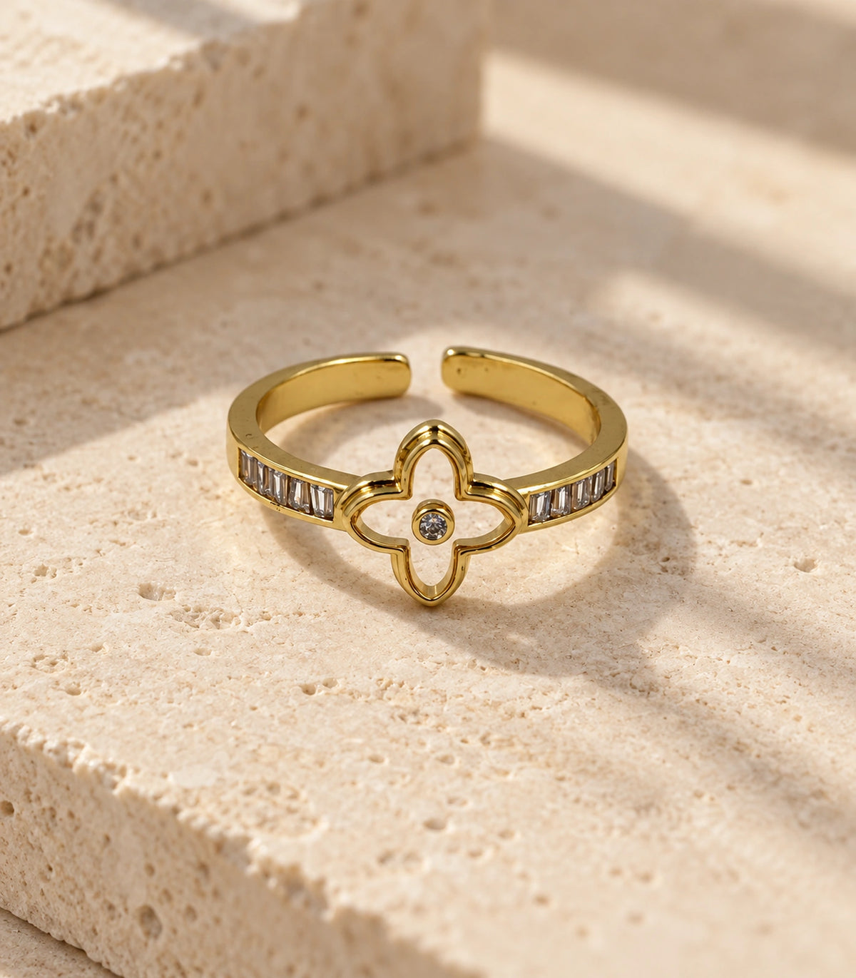 Gold Open Clover Baguette Crystal Ring — editorial flatlay view