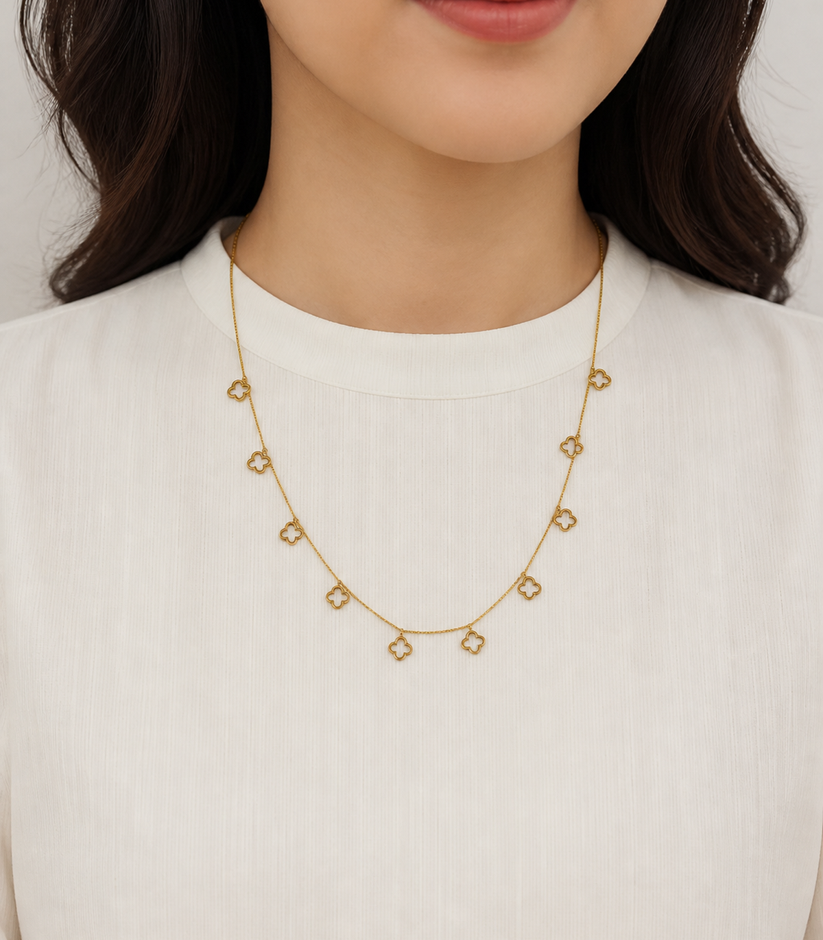 Gold Open Clover Charm Necklace worn by a model