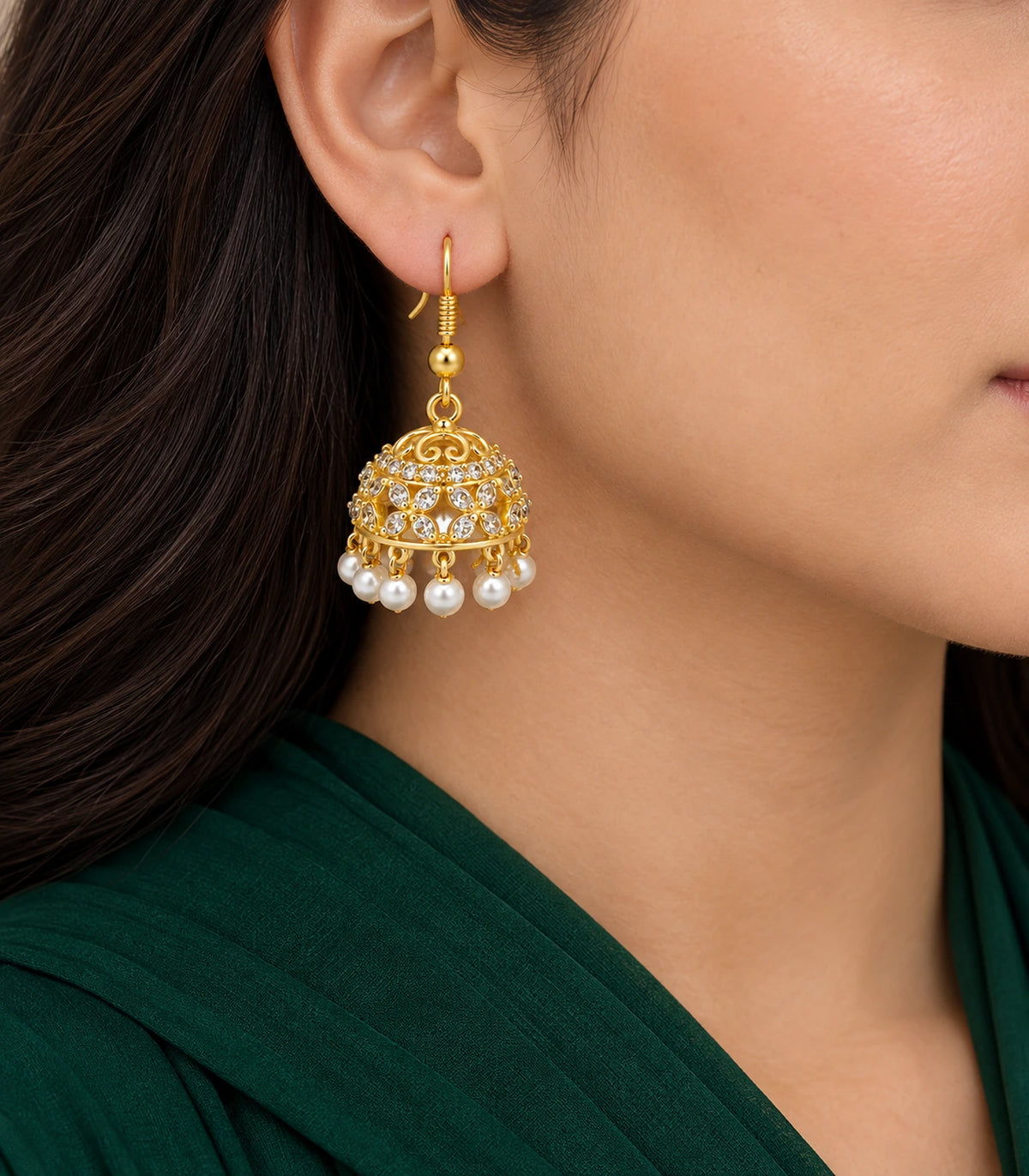 JIMIKI Gold Openwork Floral Crystal Jhumka Earrings - Earring worn with a dark green outfit #color_gold