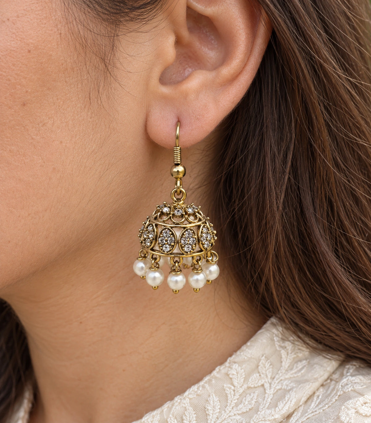 JIMIKI Gold Oval Crystal Pearl Hook Jhumka Earrings - Gold close-up of earring worn on the ear #color_gold