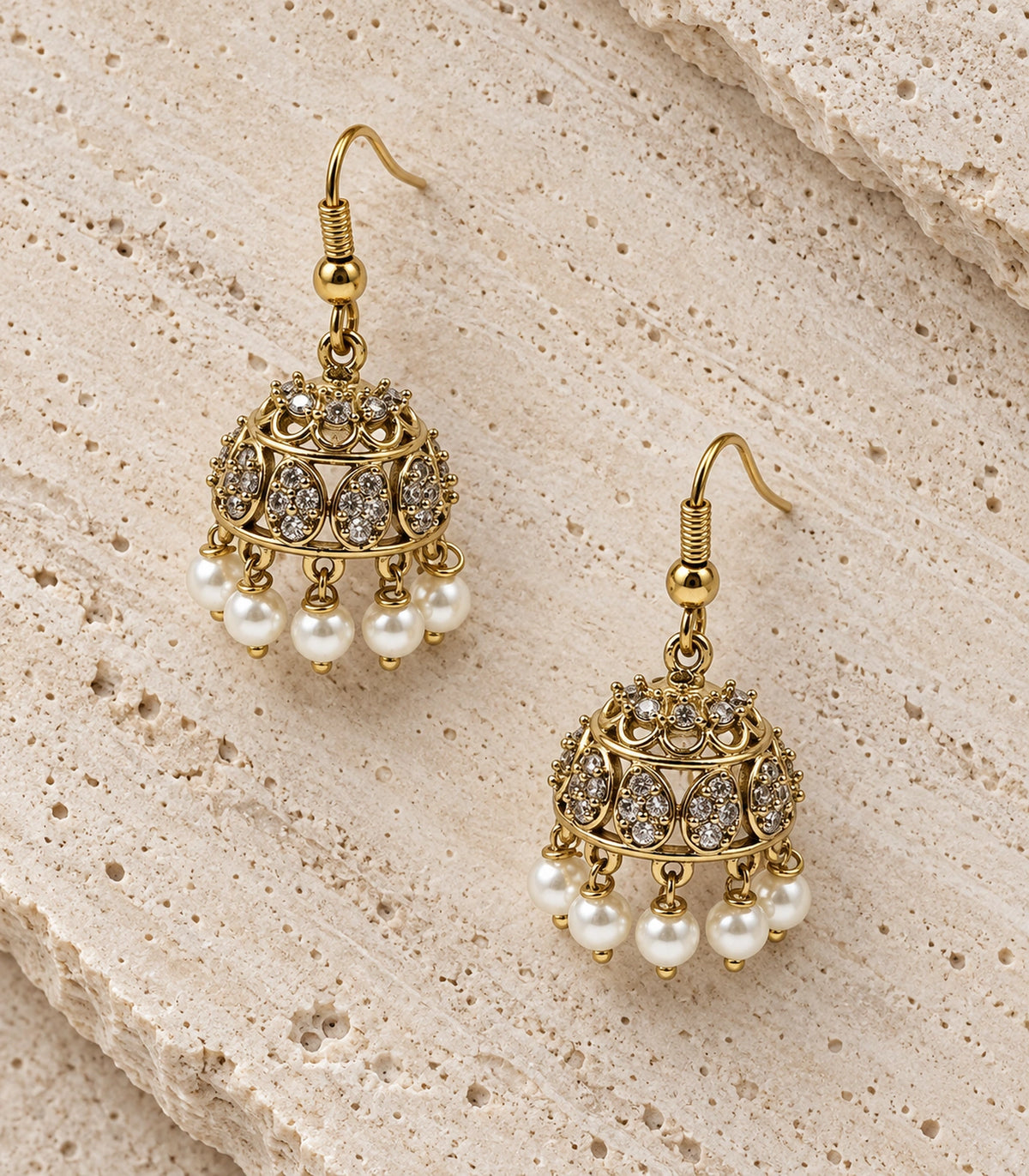 JIMIKI Gold Oval Crystal Pearl Hook Jhumka Earrings - Gold pair in a styled flatlay #color_gold