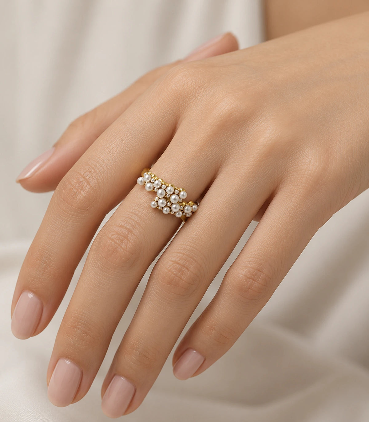 Gold Pearl Cluster Crossover Ring worn on a finger