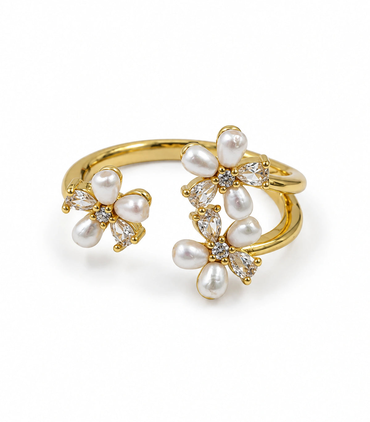 Gold-tone open ring with three pearl-like and clear crystal floral clusters on white