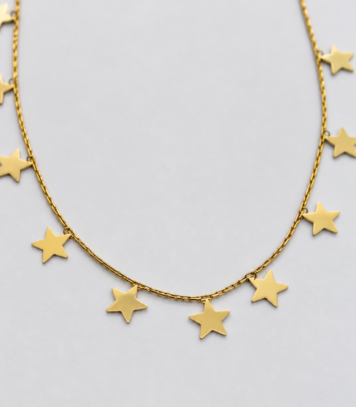 Close-up of Gold Star Charm Necklace