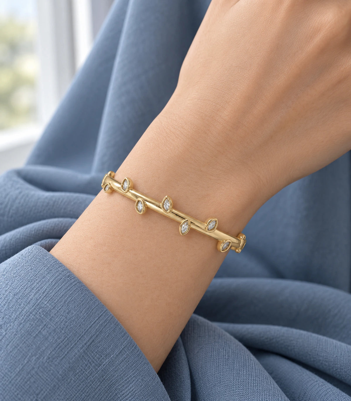 JIMIKI Gold-Tone Alternating Marquise Crystal Bangle — bangle styled with an outfit #color_gold-tone / clear