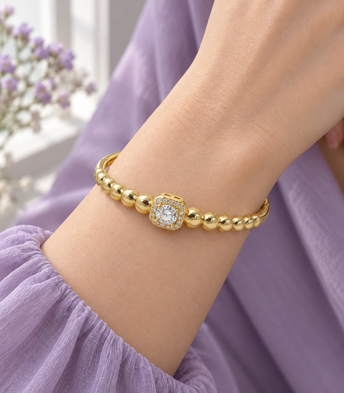 JIMIKI Gold-Tone Beaded Square Halo Bangle — bangle styled with an outfit #color_gold-tone / clear