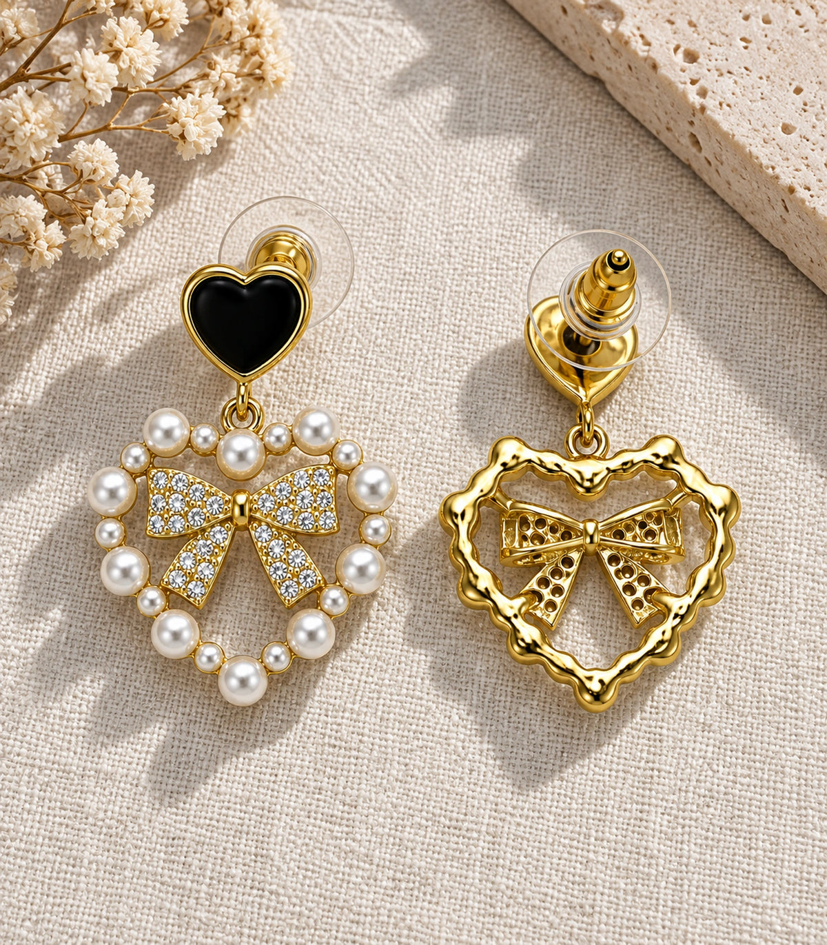 JIMIKI Heart Pearl Bow Drop Earring Pair in Gold Tone / Black, editorial flat lay #color_gold tone / black