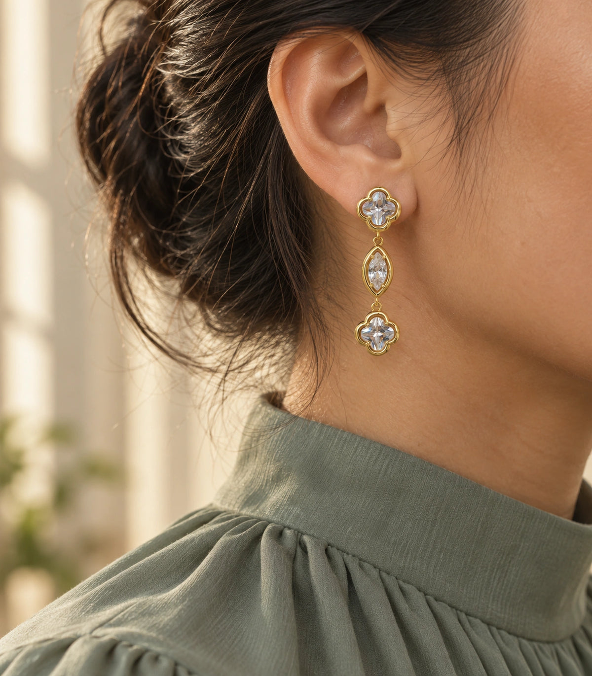 JIMIKI Clover Marquise Crystal Drop Earrings in Gold Tone, editorial model view #color_gold tone