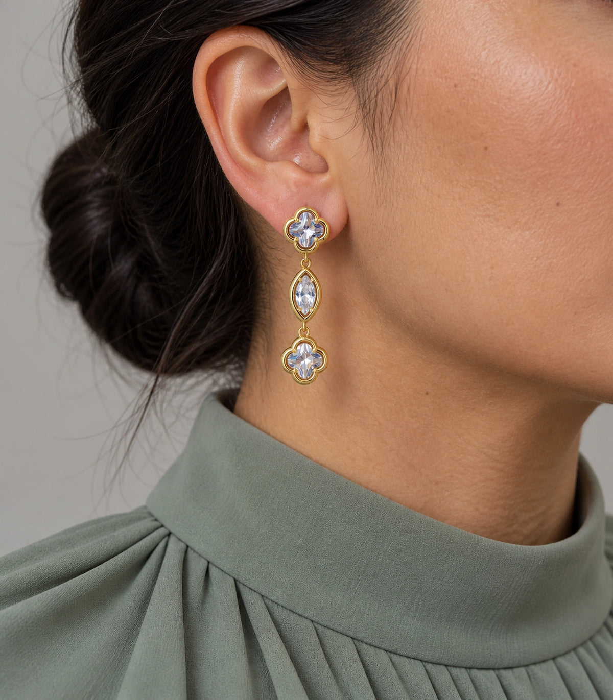 JIMIKI Clover Marquise Crystal Drop Earrings in Gold Tone, model wearing view #color_gold tone