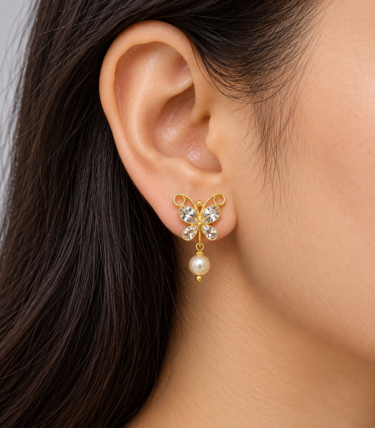 JIMIKI Clear Crystal butterfly pearl drop earrings, worn on the ear #color_clear-crystal