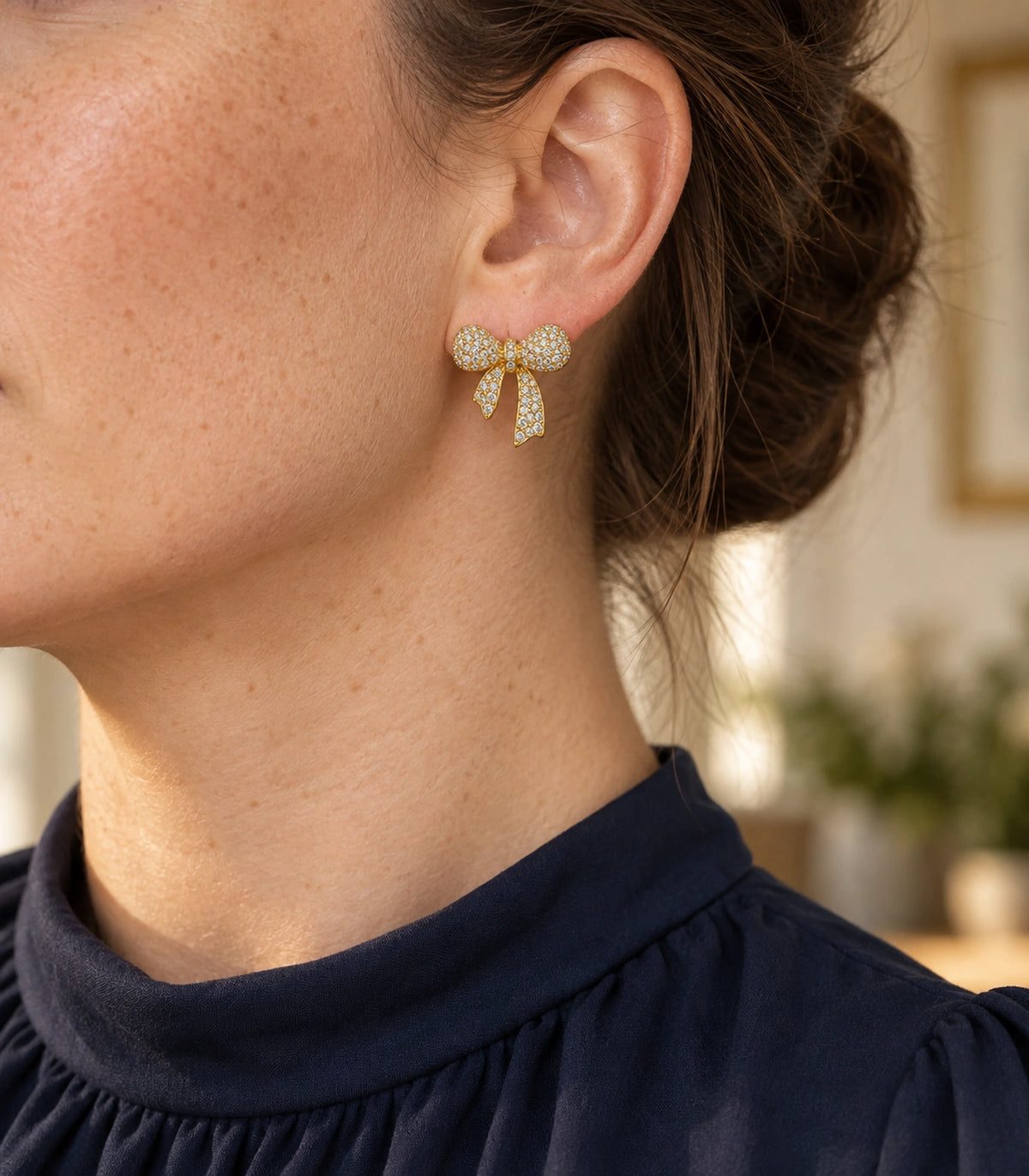 JIMIKI Pave Ribbon Bow Stud Earring Pair in Gold-tone, editorial model view #color_gold-tone