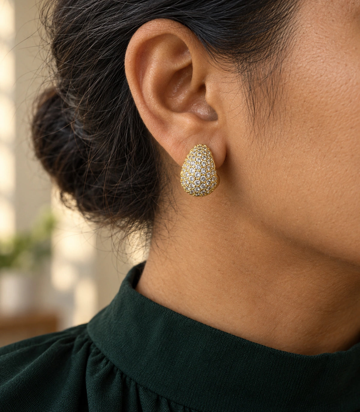 JIMIKI Gold Tone Clear Pave Teardrop Stud Earring Pair in Gold-tone, editorial model view