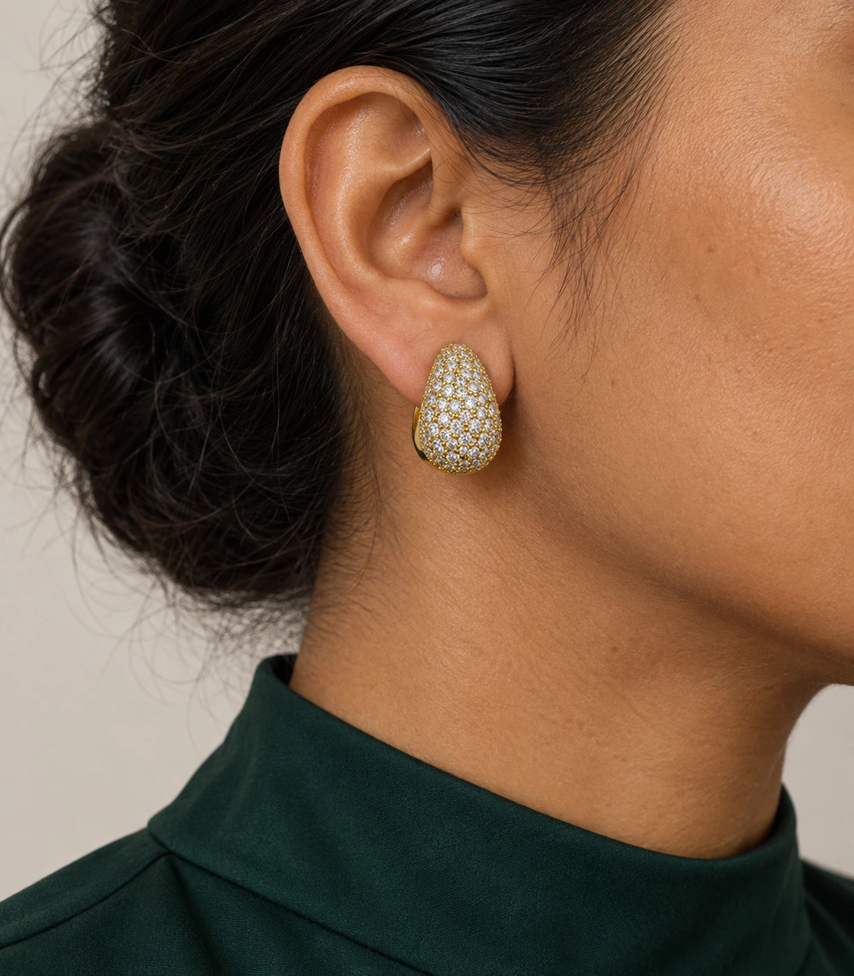 JIMIKI Gold Tone Clear Pave Teardrop Stud Earring Pair in Gold-tone, model wearing view