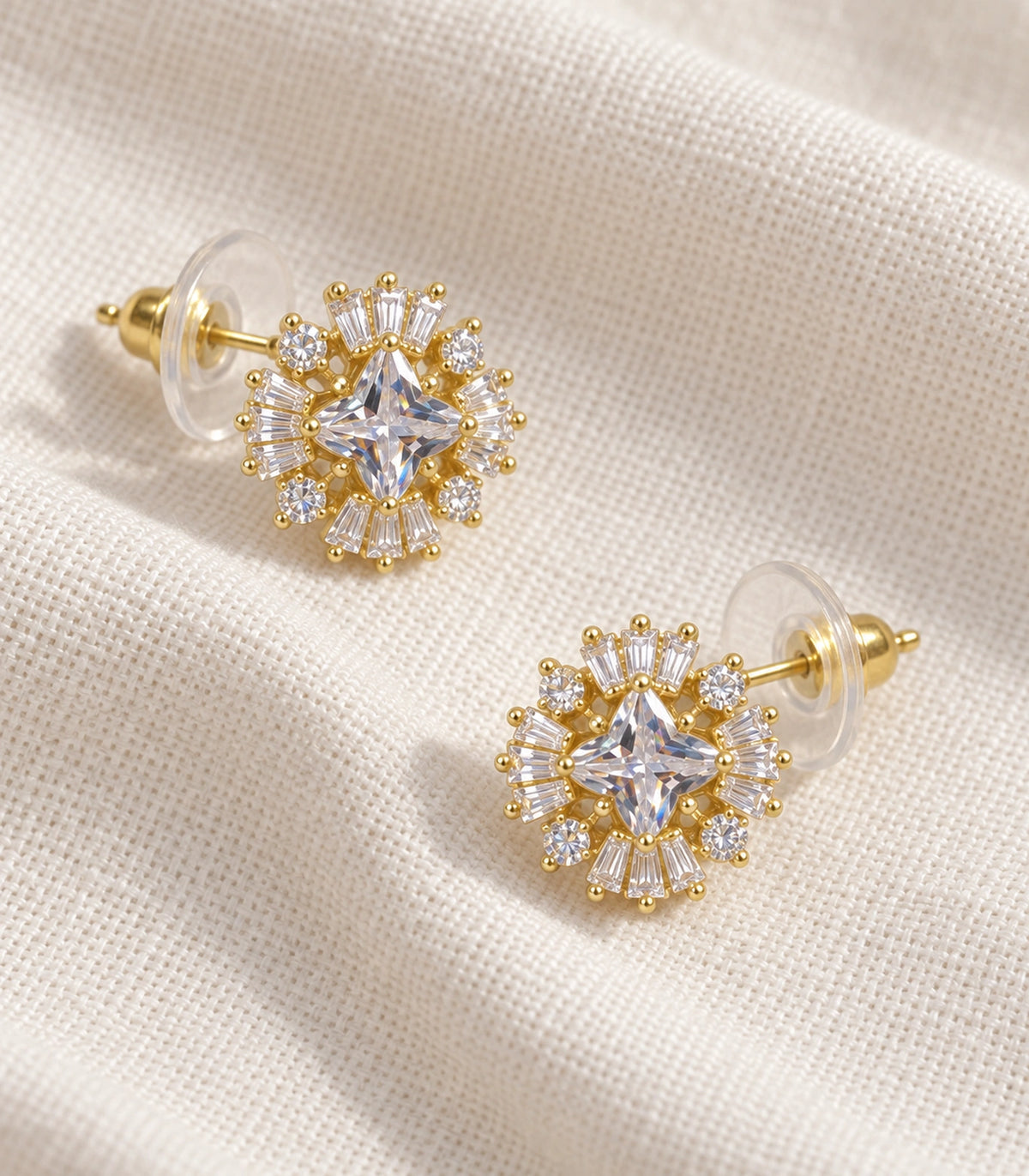 JIMIKI Star Crystal Baguette Halo Stud Earring Pair in Gold tone, editorial flat lay #color_gold tone
