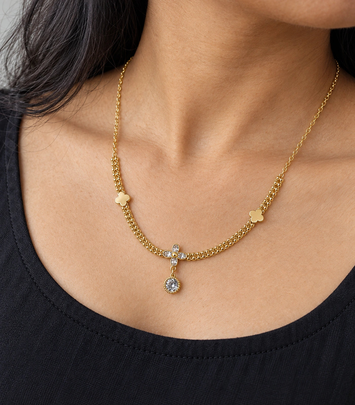 JIMIKI Clover Crystal Flower Drop Necklace in Gold Tone - close-up details #color_gold-tone