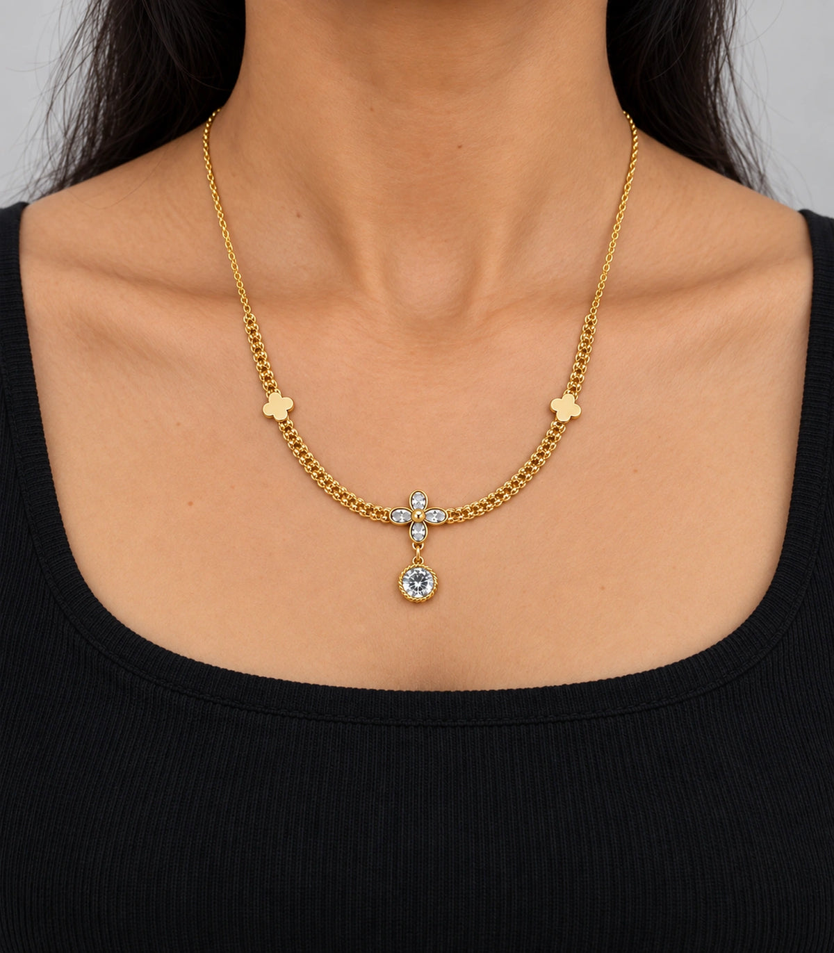 JIMIKI Clover Crystal Flower Drop Necklace in Gold Tone - worn styling view #color_gold-tone