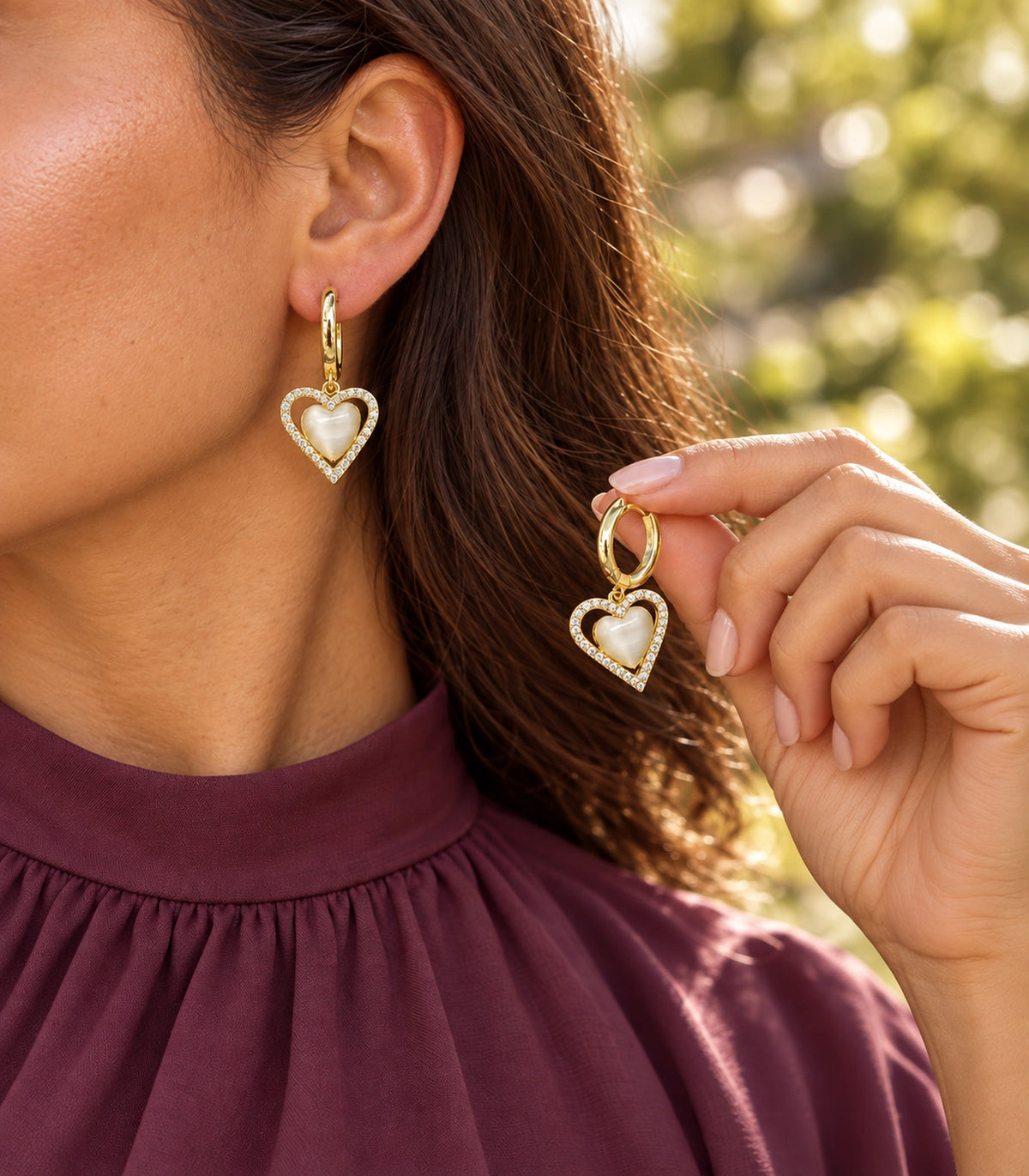 JIMIKI Heart Crystal Frame Drop Hoop Earring Pair in Gold-tone / Cream, editorial model view #color_gold-tone / cream