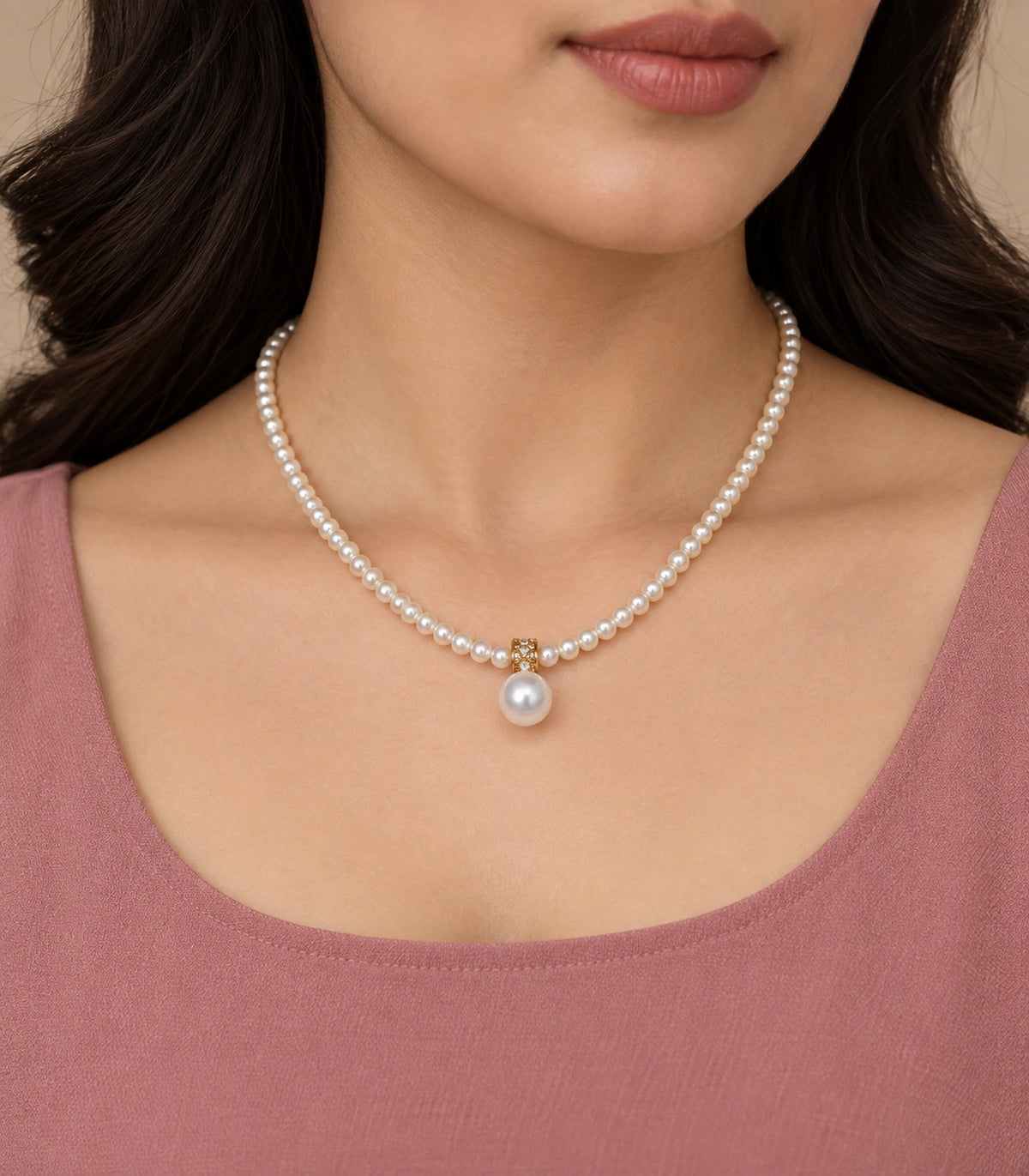 JIMIKI Gold-Tone Crystal Bail Pearl Drop Necklace in Gold-tone / white, worn with a simple outfit
