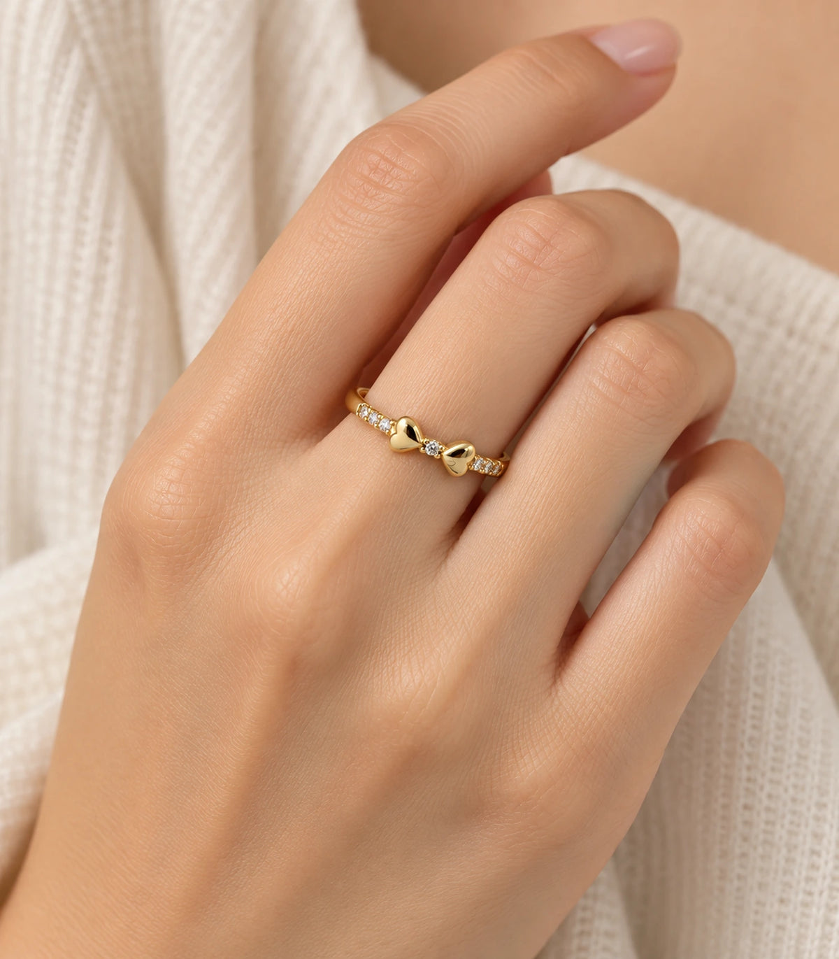 JIMIKI Gold Tone Crystal Bow Ring in Gold Tone - worn styling view #color_gold-tone