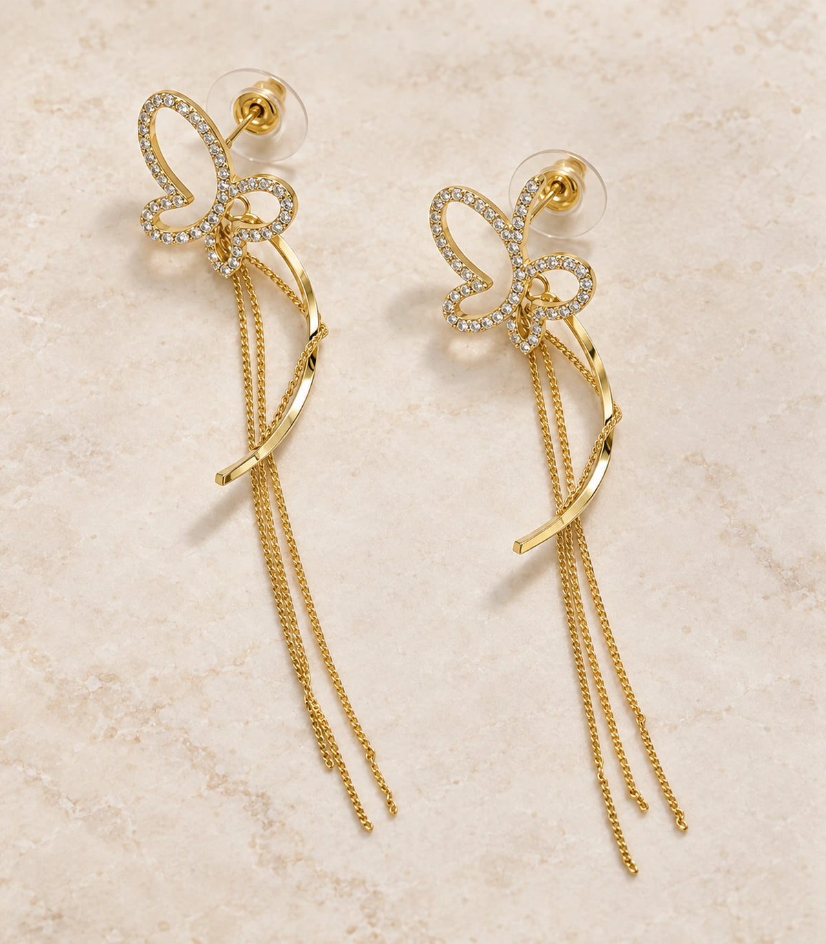 JIMIKI Butterfly Ribbon Chain Drop Earrings in Gold-tone, editorial flat lay #color_gold-tone