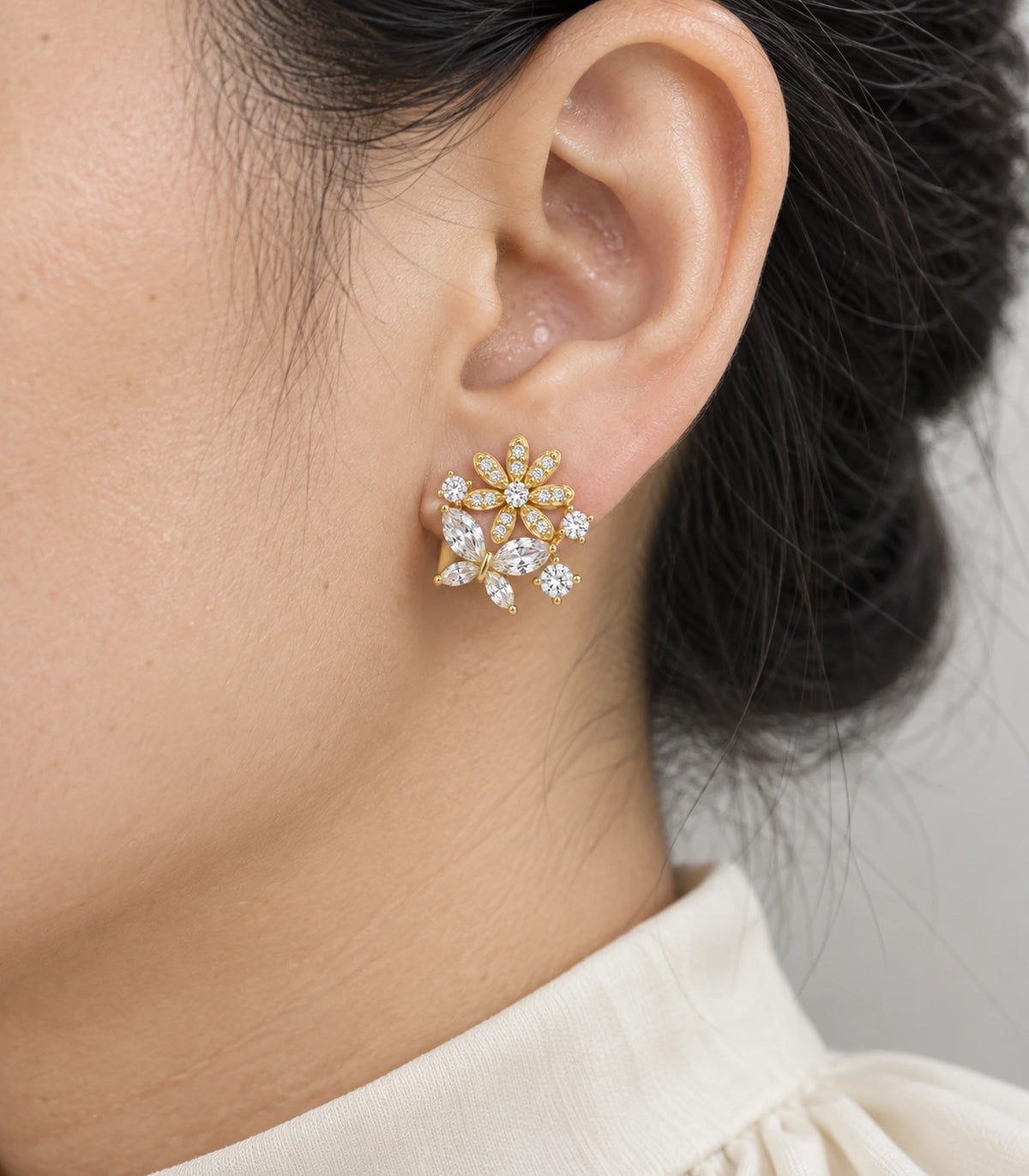 JIMIKI Gold Tone Crystal Flower Butterfly Cluster Stud Earring Pair in Gold-tone, close-up detail