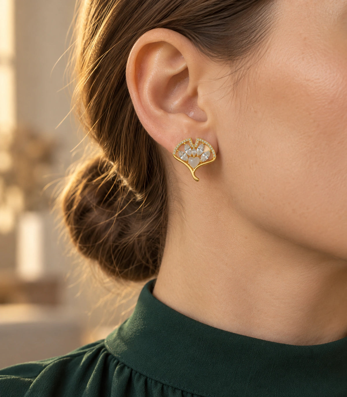 JIMIKI Gold-Tone Crystal Ginkgo Leaf Heart-Accent Stud Earrings in Gold / Clear / Milky White, editorial model view