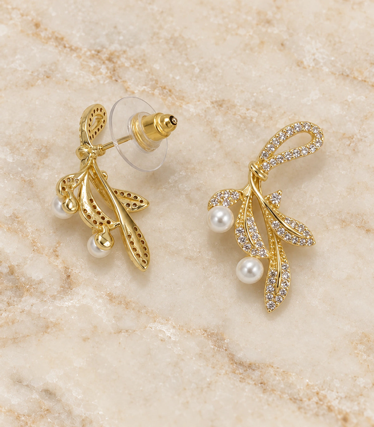 JIMIKI Crystal Leaf Two Pearl Drop Earring Pair in Gold-tone, editorial flat lay #color_gold-tone